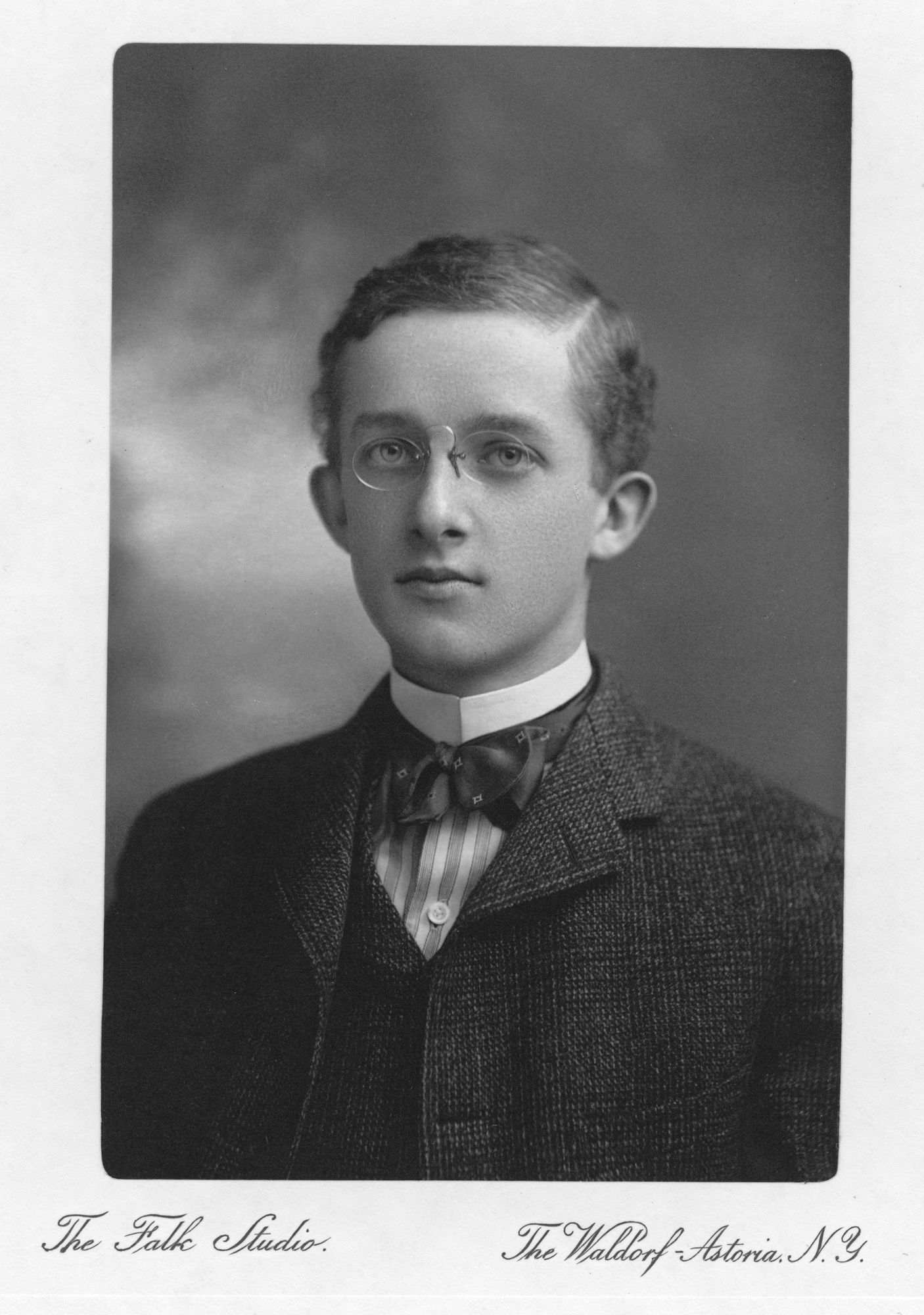 Portrait of Childs Frick, a young man wearing glasses